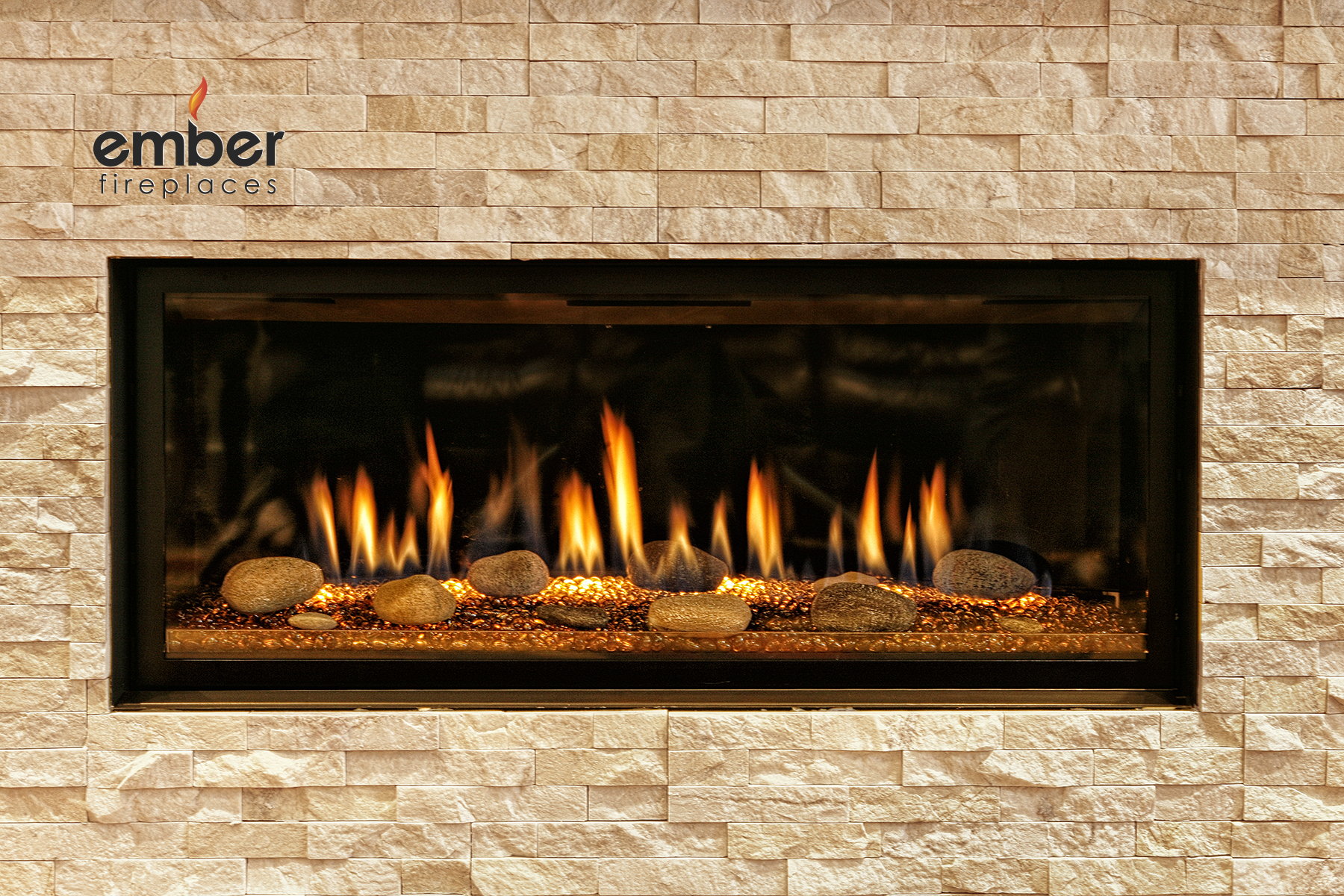 Modern linear gas fireplace with copper surround and slate tile at Ember Fireplaces