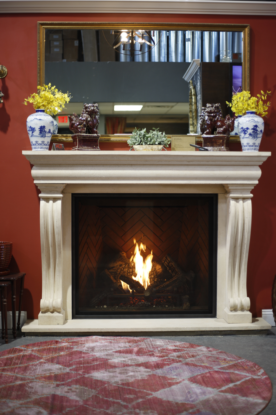 Traditional gas fireplace with herringbone firebox burning at Ember Fireplaces